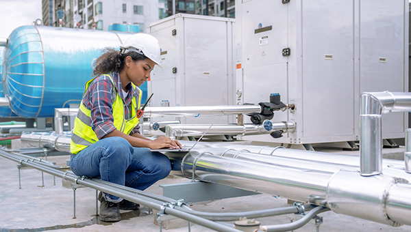 Engineer inspecting cooling and energy system