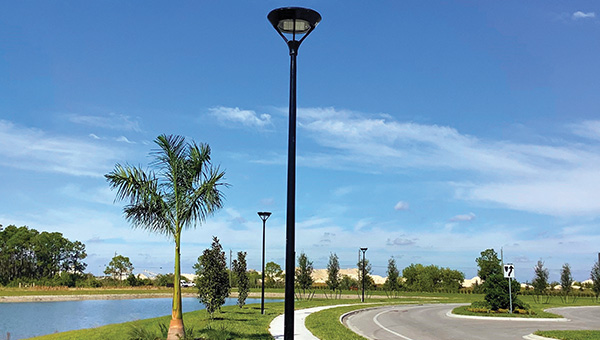 LED light fixture on the sidewalk on daylight 